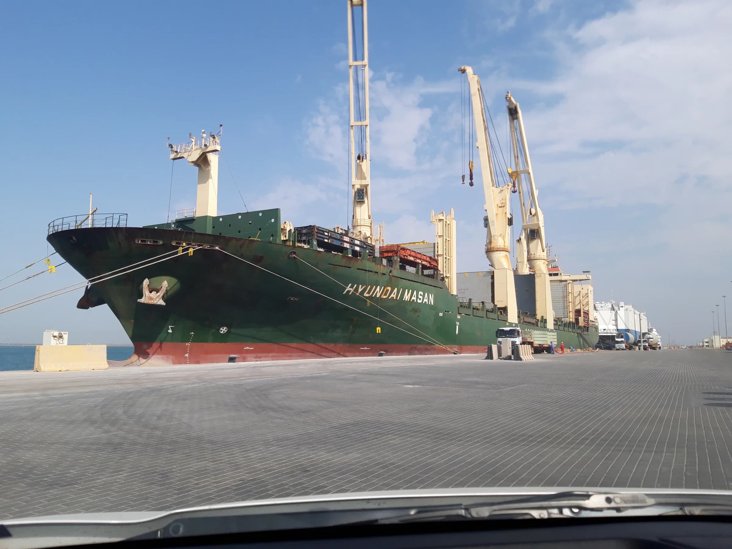 Cargo vessel moored at a working quay.